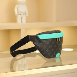 Alternative view of This Discovery waist bag is crafted from Monogram Eclipse canvas, featuring vibrant leather accents and distressed metal hardware. It securely stores personal items with a double zipper closure and a back patch pocket. Its elegant design allows for shoulder, crossbody, or waist wear. Dimensions: 44 x 15 x 9 cm (Length x Height x Width)